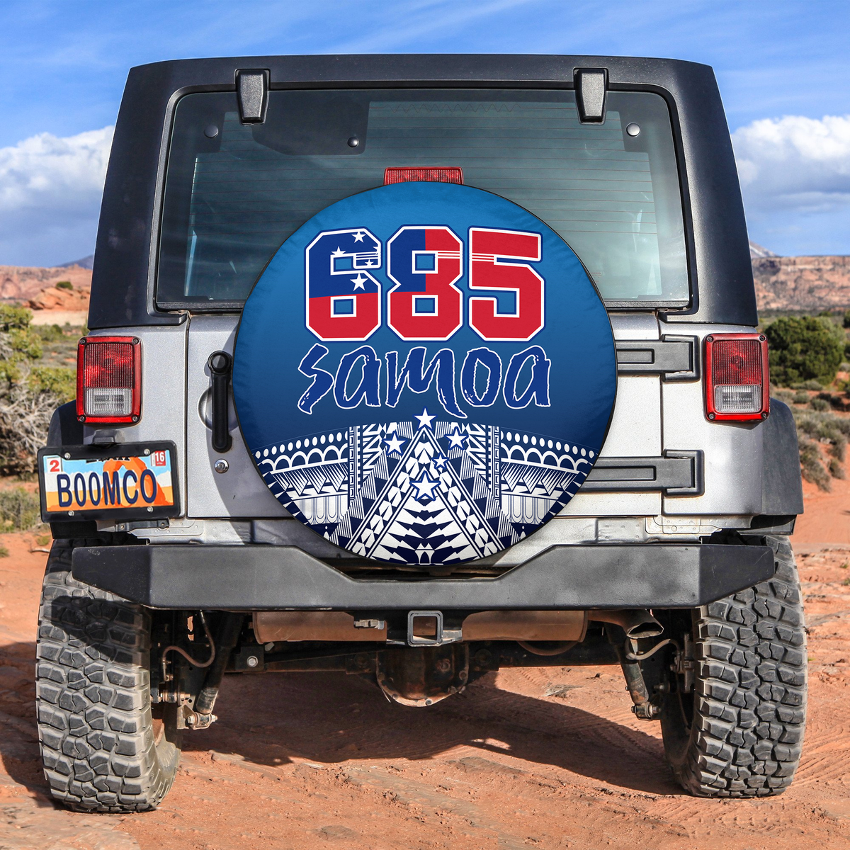 Blue 85 Samoa spare tire cover with graphic emblem, fitted for rear wheel