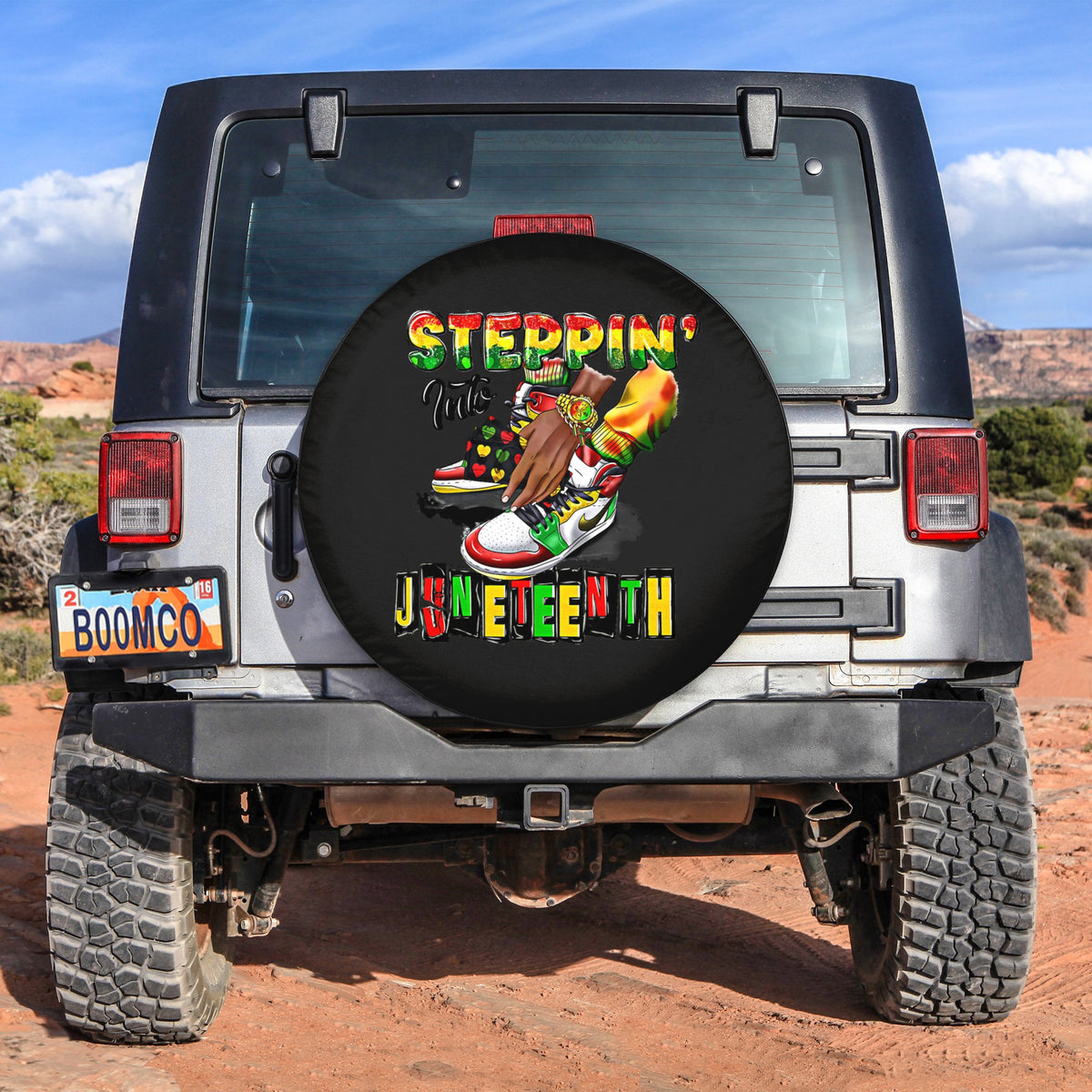 Black spare tire cover with Steppin' Into Juneteenth colorful graphic