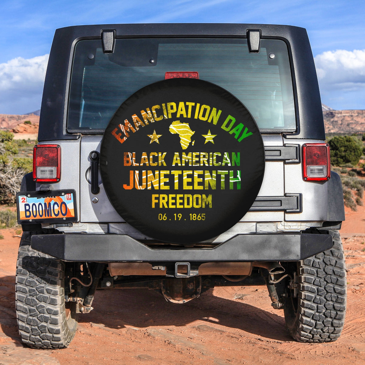 Black circular spare tire cover with Juneteenth lettering and emancipation theme graphic