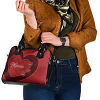 Red heart patch shoulder handbag with black top handles and glossy black strap accents
