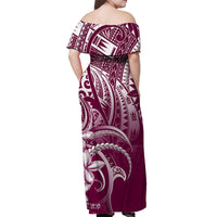Back view off-shoulder maxi dress with tribal print in maroon, pink, and white.
