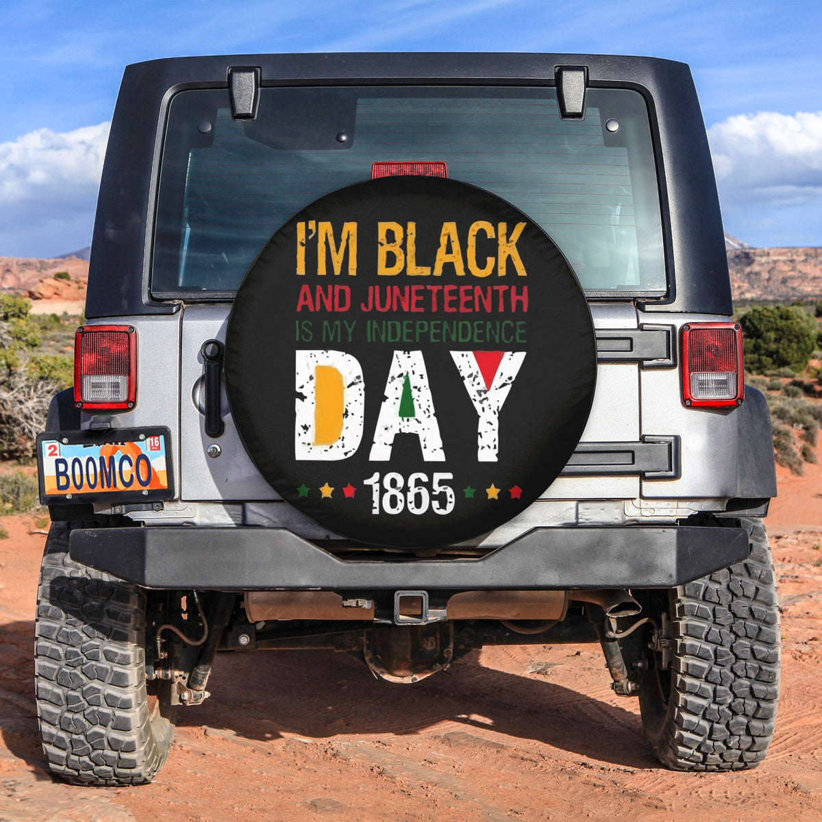 Black circular spare tire cover with Juneteenth graphic and text, 1865.