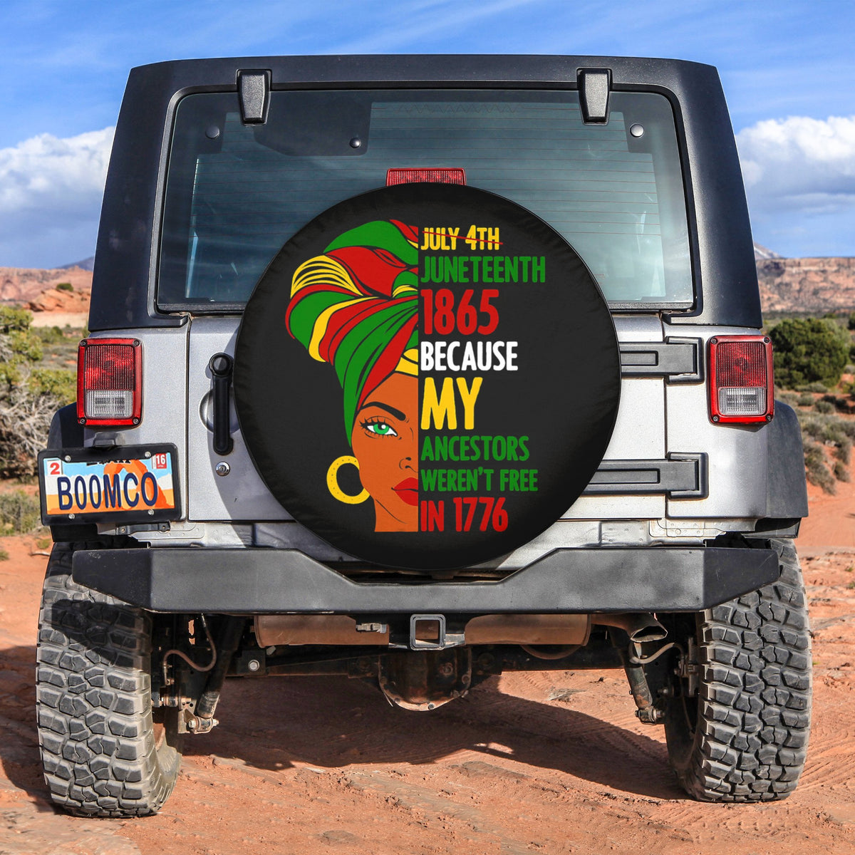 Black circular Juneteenth spare tire cover with portrait and bold red green lettering