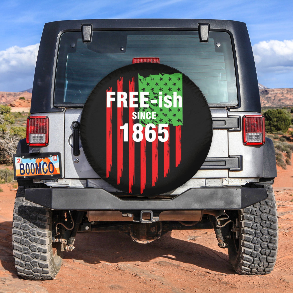 Spare tire cover with circular graphic, red stripes and green stars