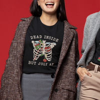 Black crewneck T-shirt worn by model, showing skeleton graphic and “DEAD INSIDE BUT JOLY AF”