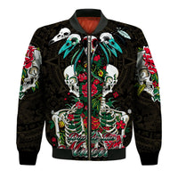 Black bomber jacket with colorful floral skull graphic and ribbed cuffs.