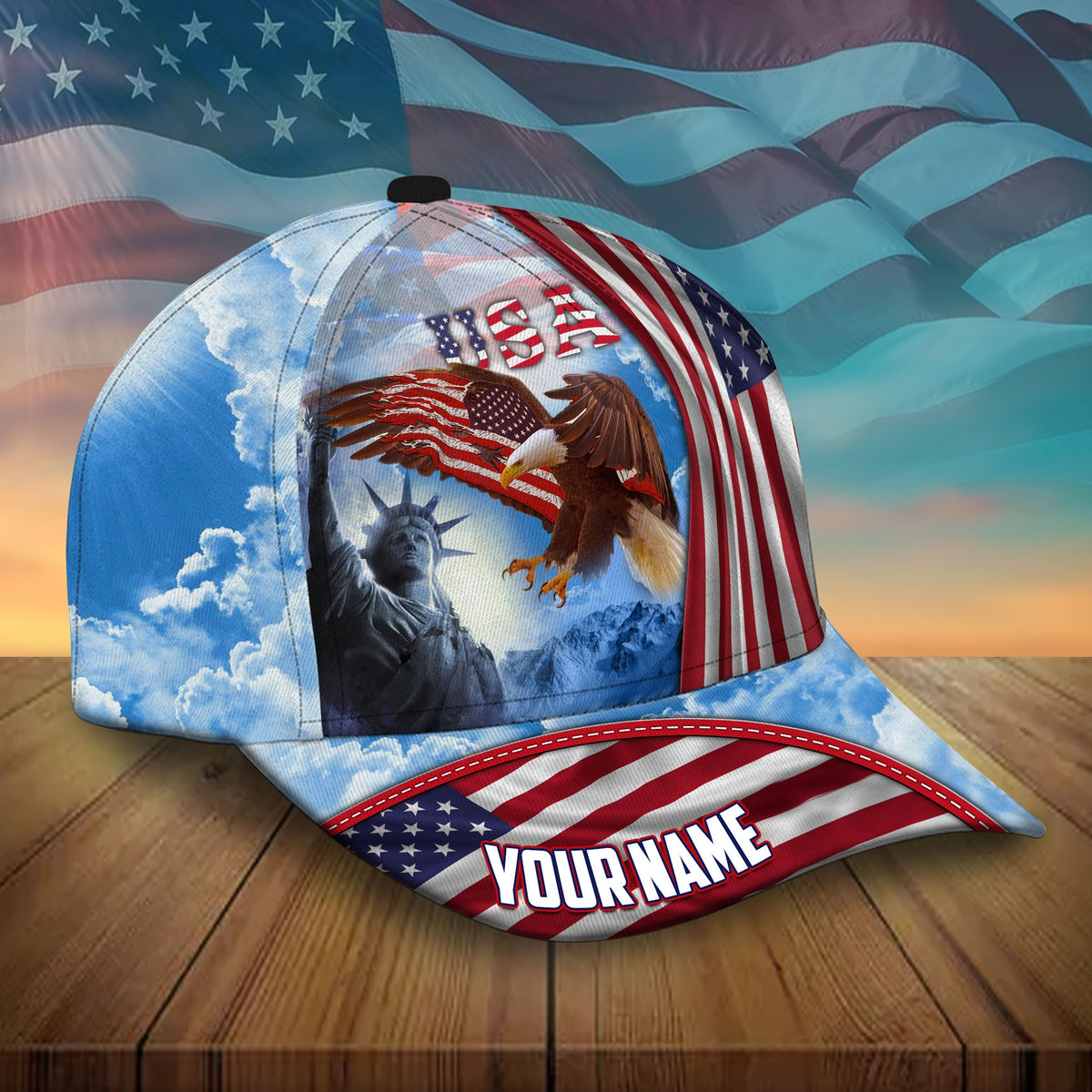 Patriotic baseball cap with USA, eagle, and liberty statue scene; 'YOUR NAME' front patch