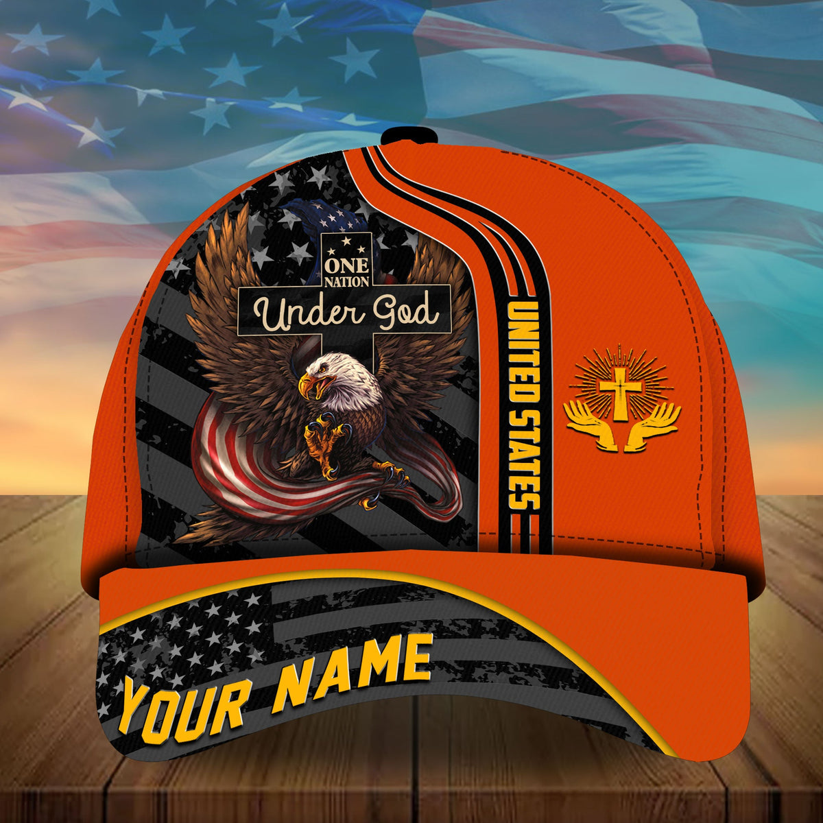 Orange baseball cap with eagle “Under God” panel and “YOUR NAME” striped brim