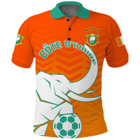 Orange polo shirt with green collar, front soccer graphic, and emblem patch.