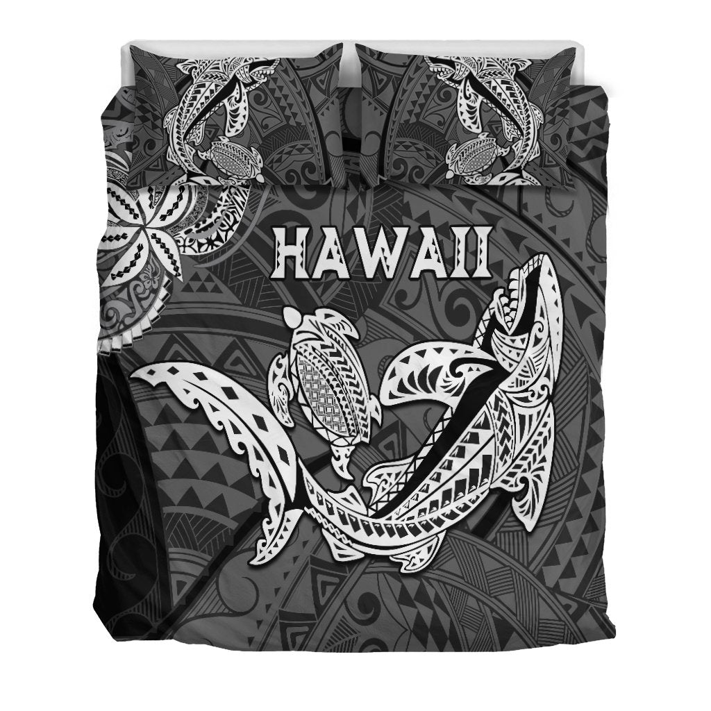 Black bedding set showing Hawaii text and large central shark and turtle print