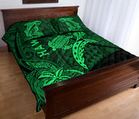 Green Hawaii shark and turtle quilt on bed with matching printed fabric design