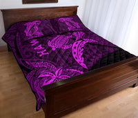 Purple shark and turtle quilt on bed, quilted diamond pattern, bold island-style graphics.