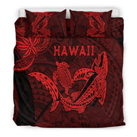 Red and dark bedding set with shark and turtle print, neatly arranged on bed