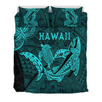 Dark teal duvet and pillowcases with turquoise shark and turtle artwork and 'HAWAII' text