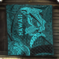 Turquoise quilted quilt with shark and turtle motifs and vertical 'HAWAII' text