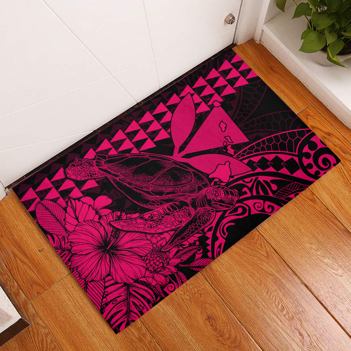 Pink Polynesian-style door mat with sea turtle and floral graphic