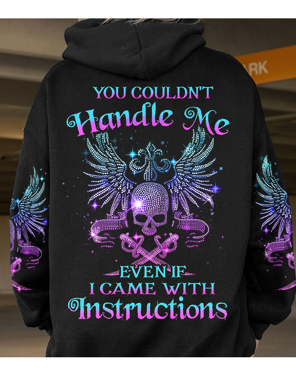 Black hoodie with winged skull graphic, colorful text on back, long sleeves
