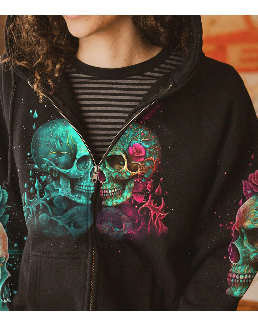Black zip-up hoodie with colorful twin skull and rose graphic, full front zipper