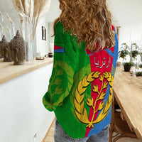 Women’s casual shirt with green/blue/red back graphic and Arabic text, oversized lion-tree emblem