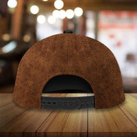 Brown leather baseball cap back view with snapback strap and ventilation eyelets