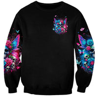 Black crewneck sweatshirt with small fairy skull graphic and colorful sleeve art