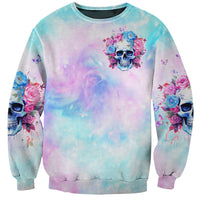 Unisex crewneck sweatshirt in blue tie-dye with flower skull graphic on chest
