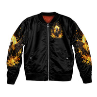 Black zip-up bomber jacket with front angel skull graphic and flame wing sleeves; ribbed hem