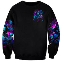 Black witch skull sweatshirt with small chest graphic and blue-purple sleeve art