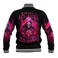 Black baseball jacket with varsity striped collar and pink skull graphic on back