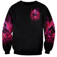 Black unisex sweatshirt with small magenta witch skull chest print and magenta sleeve art