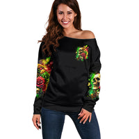 Women’s black off-shoulder sweater with skull-and-rose front graphic, long sleeves