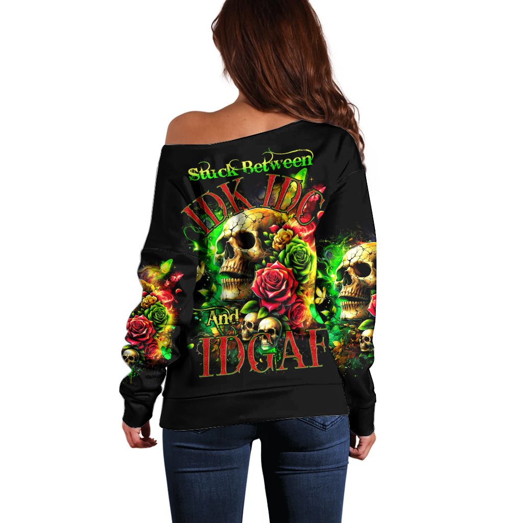 Women’s black off-shoulder sweater with skull and rose graphic, long sleeves (back view)