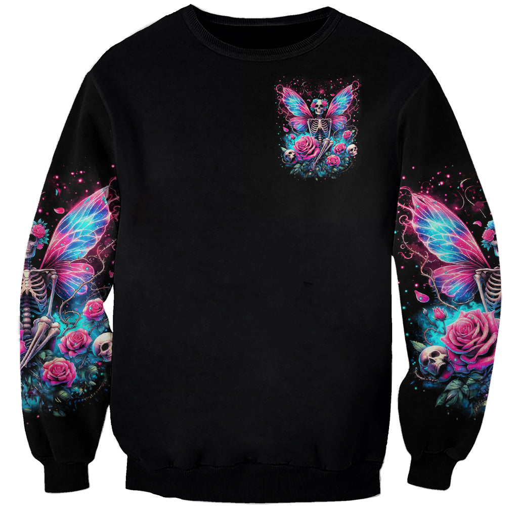 Black crewneck sweatshirt with small fairy skull butterfly print on chest, printed sleeves