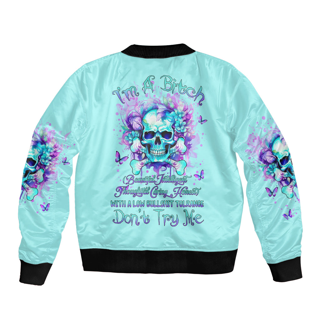 Light blue unisex bomber jacket with black rib trim and colorful skull floral back graphic