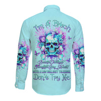 Unisex light blue long-sleeve button shirt with skull-flower graphic, back view