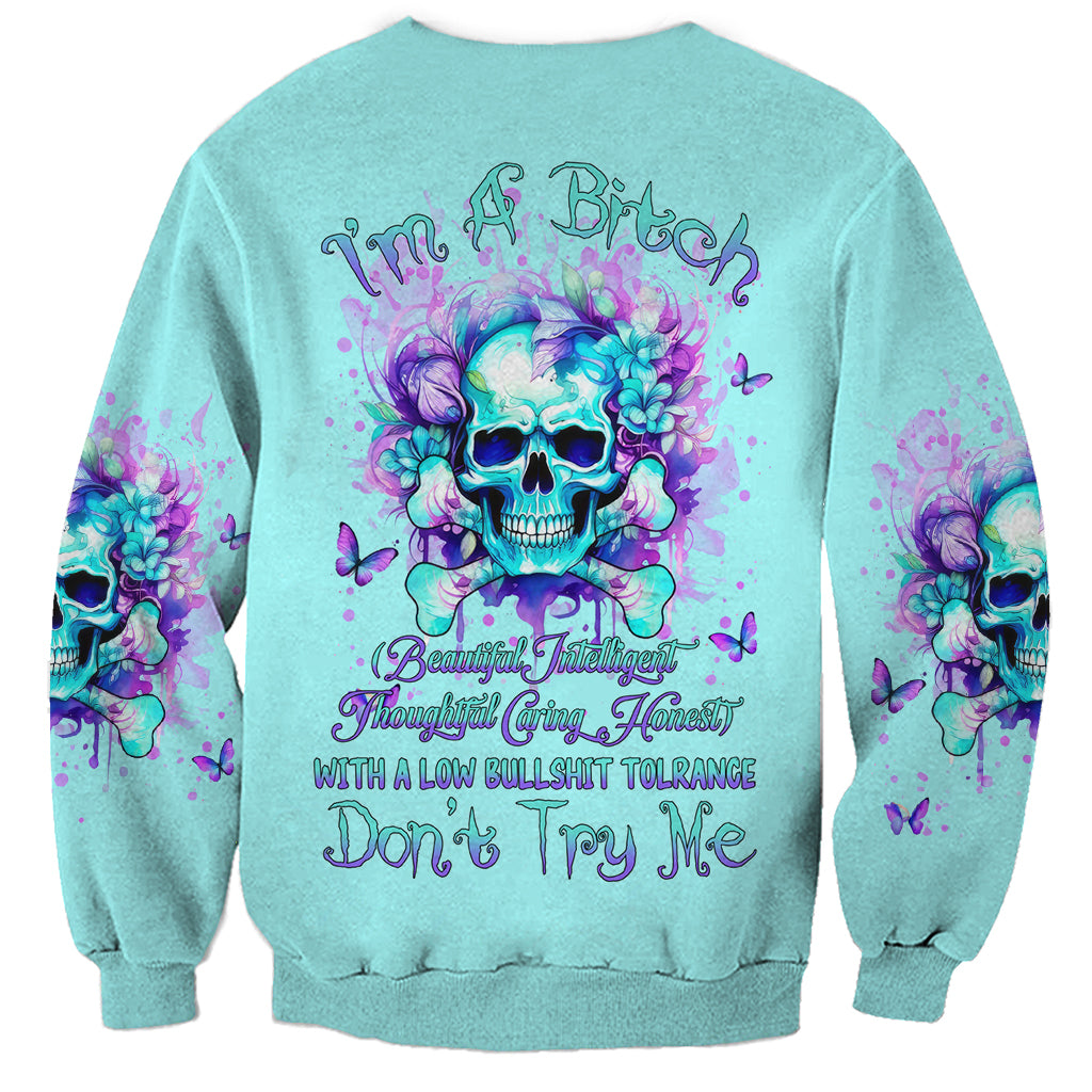 Unisex teal sweatshirt with purple flower skull back graphic and long sleeves