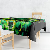 Rectangular tablecloth draped over table, green skull flame pattern on black