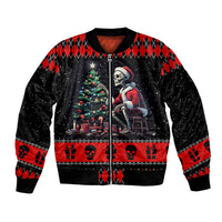 Unisex black bomber jacket with red argyle, skull and skeleton holiday graphic