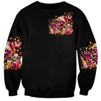 Unisex black sweatshirt with colorful Christmas skull graphic front and sleeve prints