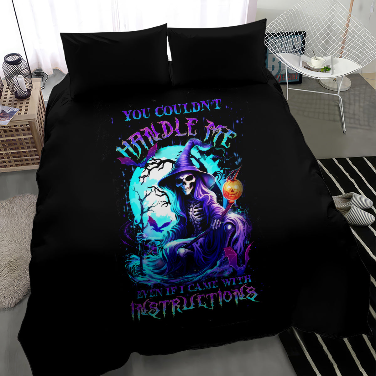 Black bedding set with blue witch skull artwork on the duvet and matching pillowcases