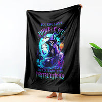 Black witch skull blanket with witch-and-skull graphic, hanging like a throw