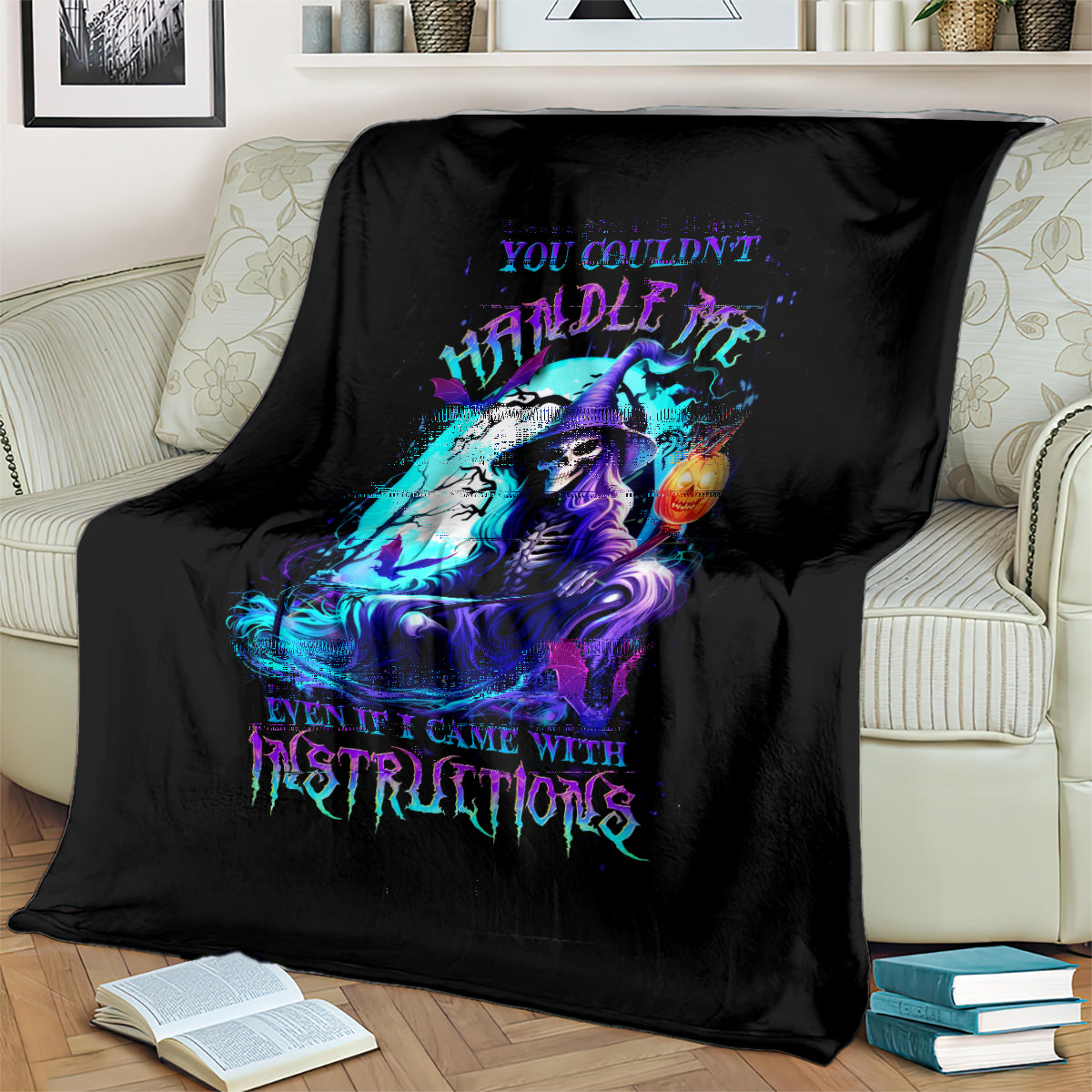 Black witch skull blanket with vivid neon witch skull artwork, folded over sofa