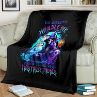 Black witch skull blanket with vivid neon witch skull artwork, folded over sofa