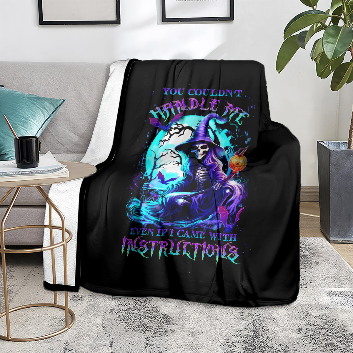 Black witch skull blanket with colorful witch skull portrait, covering couch seat