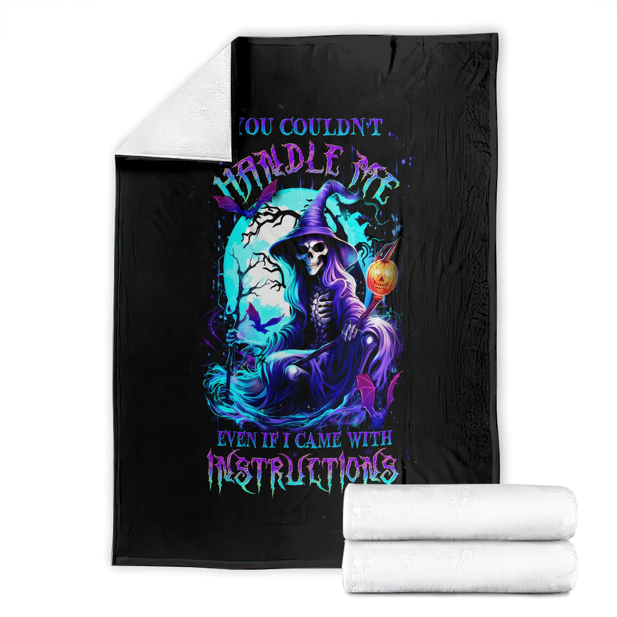 Black witch skull blanket with neon witch skull print, folded with white towels