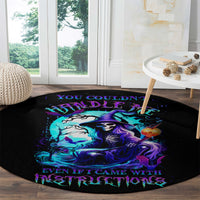 Black round carpet with witch skull illustration in purple-blue with dark lettering