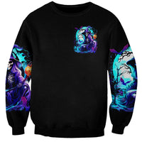 Black unisex sweatshirt with small chest witch skull print, blue-purple sleeves