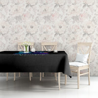 Black tablecloth with colorful skull motif on dining room table