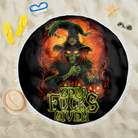 Round black beach blanket with witch skull graphic and "Zero Fucks Given" text, fringe