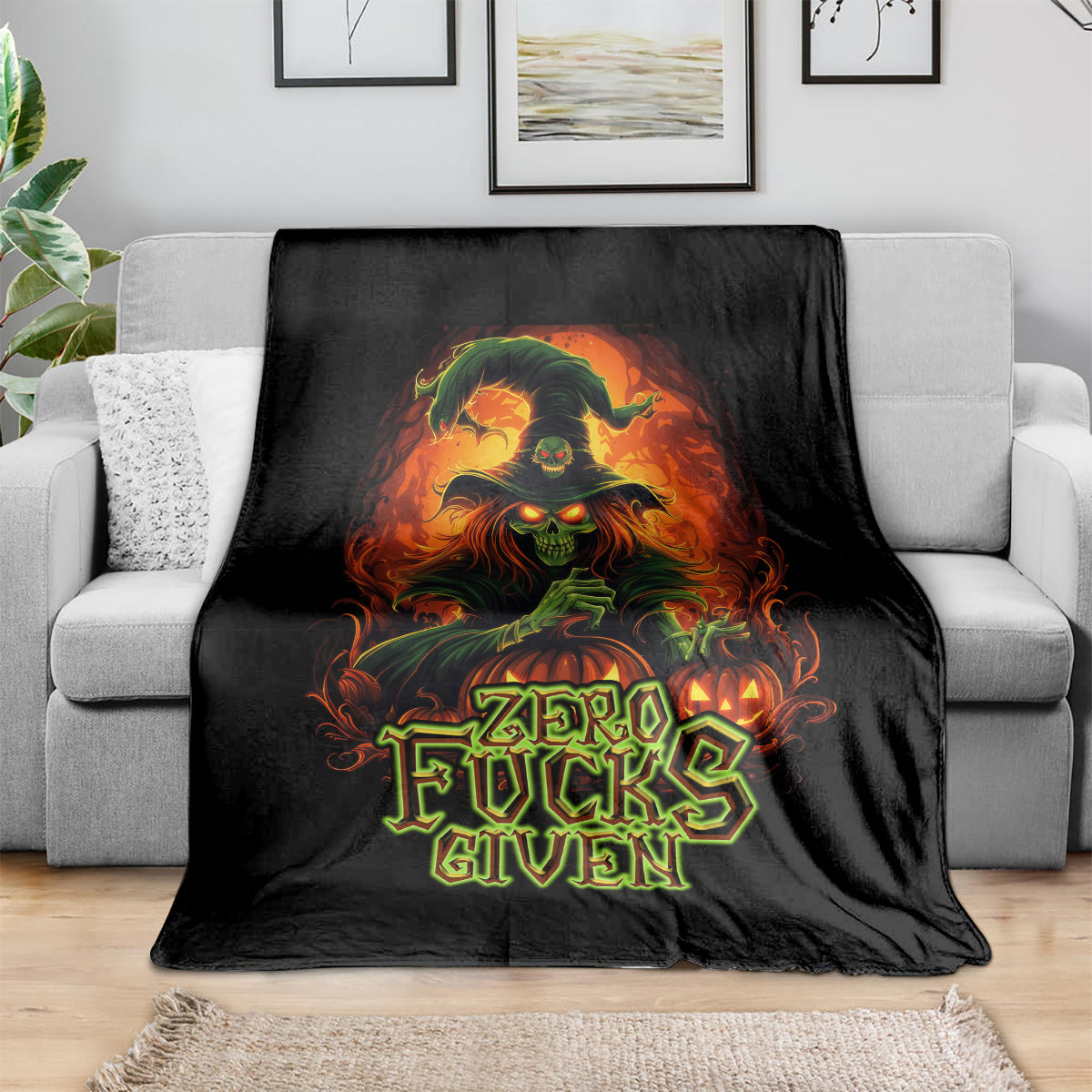 Black skull graphic blanket with colorful flames and “Zero Fucks Given” text